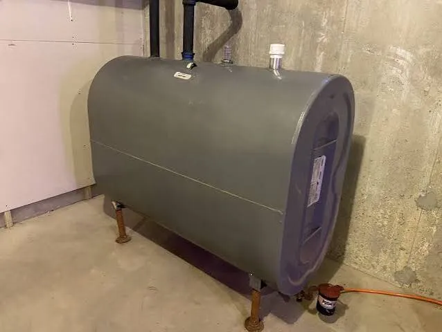 A residential home heating oil tank in a basement